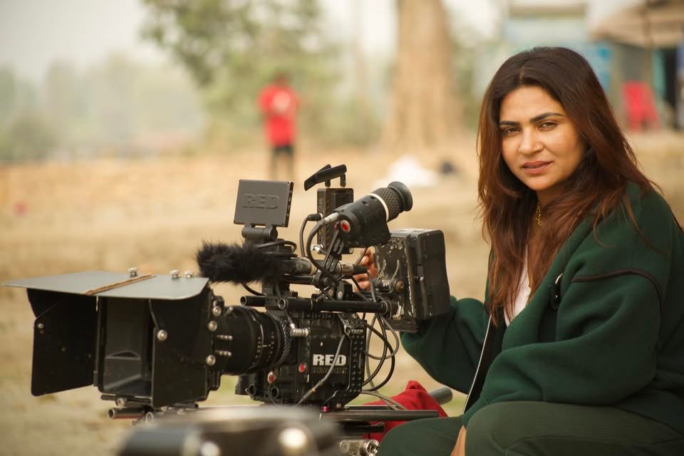 Krisha Chaulagain on set with a RED cinema camera